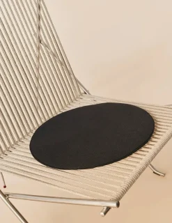 PK4 Loungestol i sort, stålstel af Poul Kjærholm